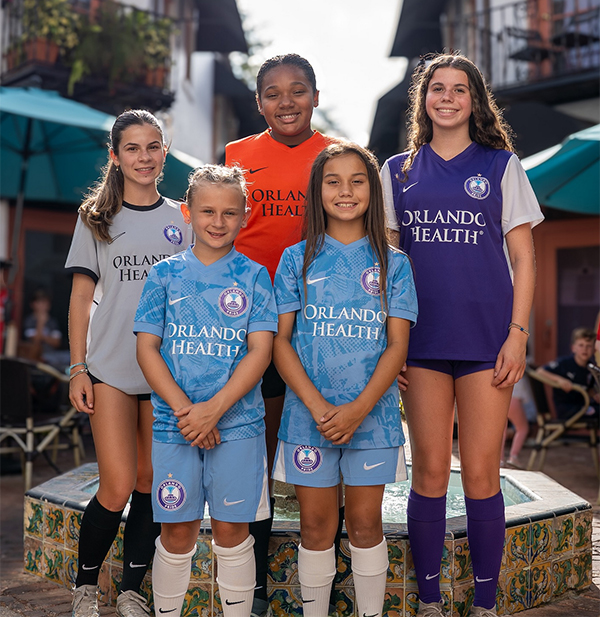 Youth Players Wearing Orlando Pride Soccer School Uniforms