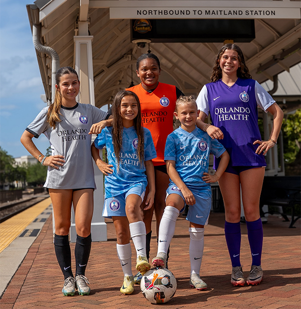 Youth Players Wearing Orlando Pride Soccer School Uniforms